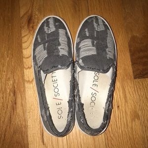 Distressed grey denim slip on shoes.